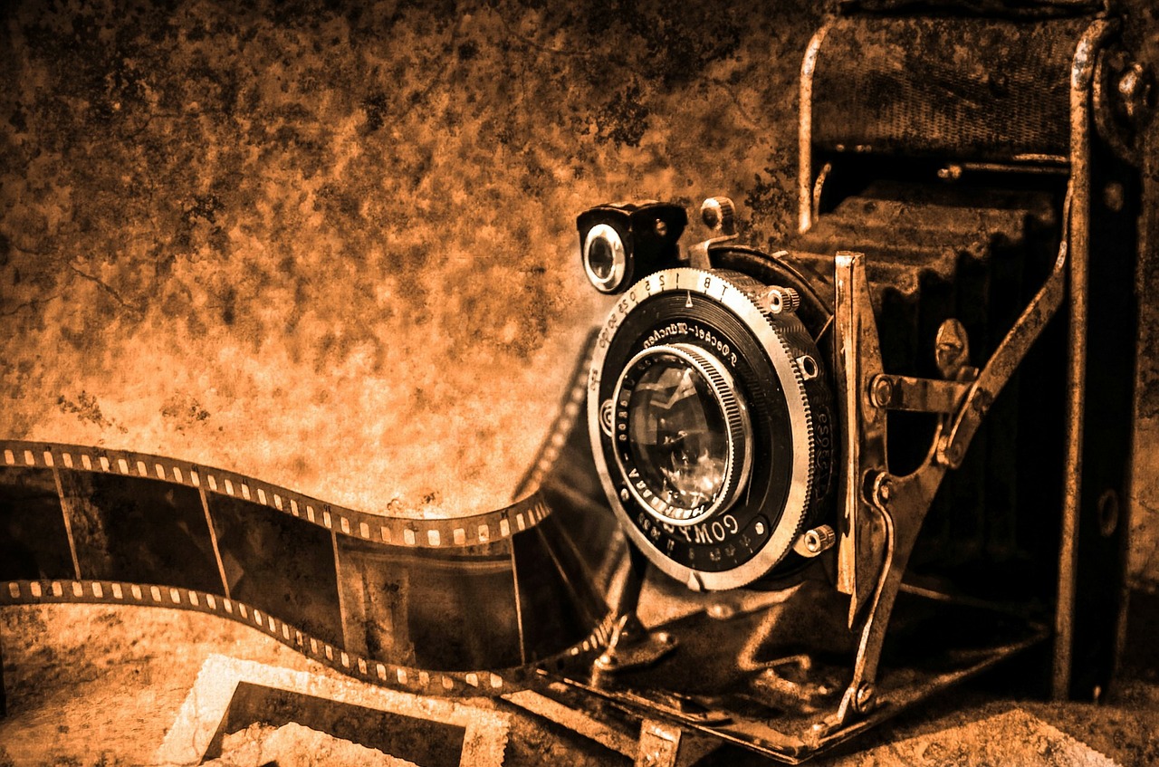 Picture of a camera with film coming out of it.