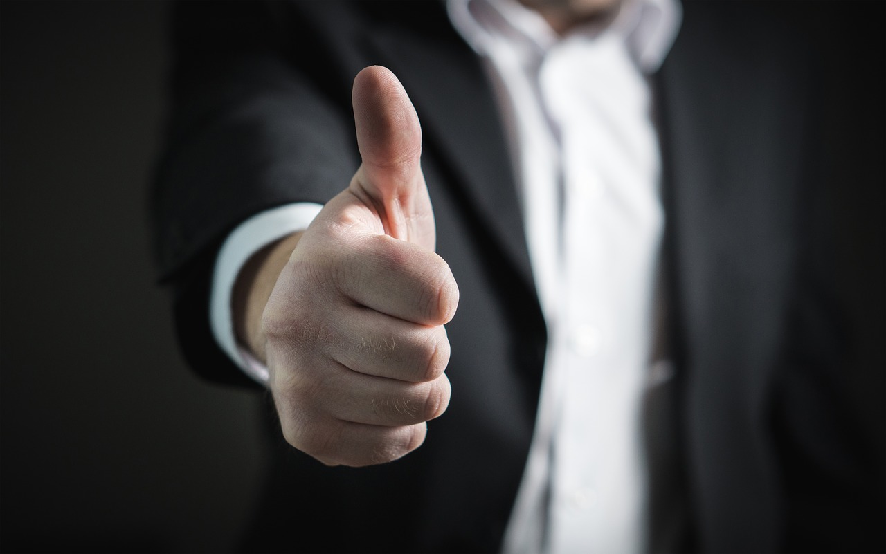 A man with his thumb up.