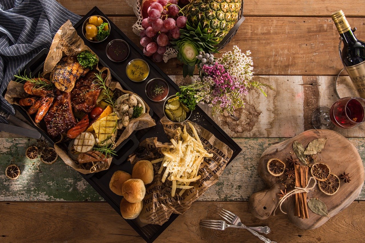 A catering table full of food and drink.