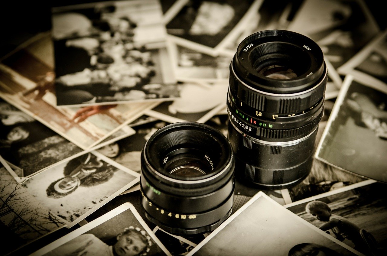 A picture of camera lenses and photographs.