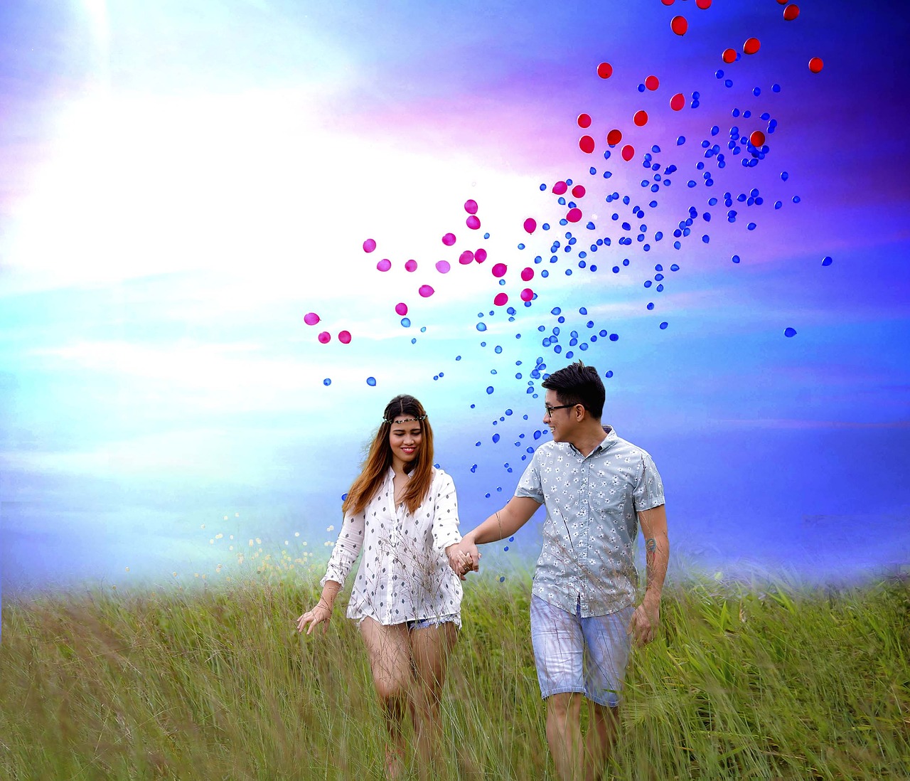 Man and woman walking in field.