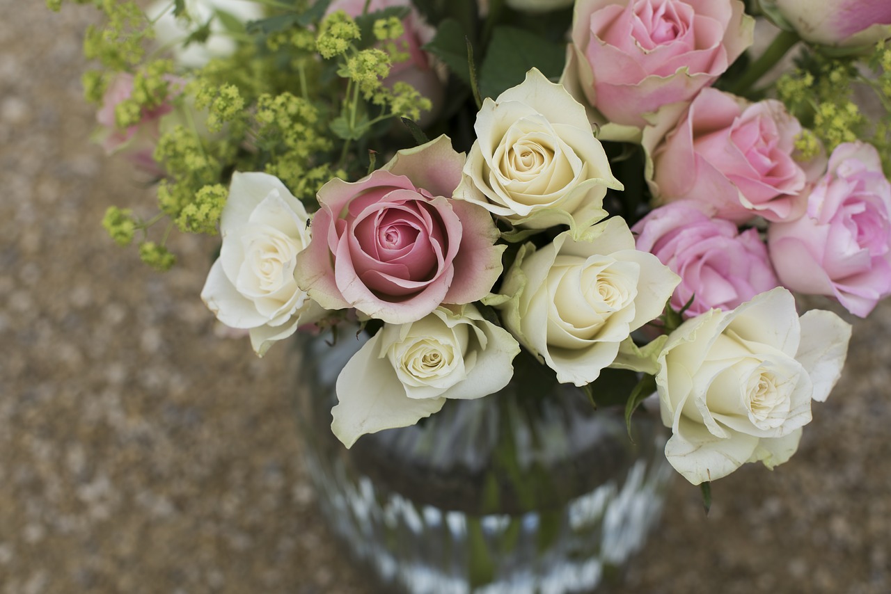 Bouquet of pink and white roses in a vase.